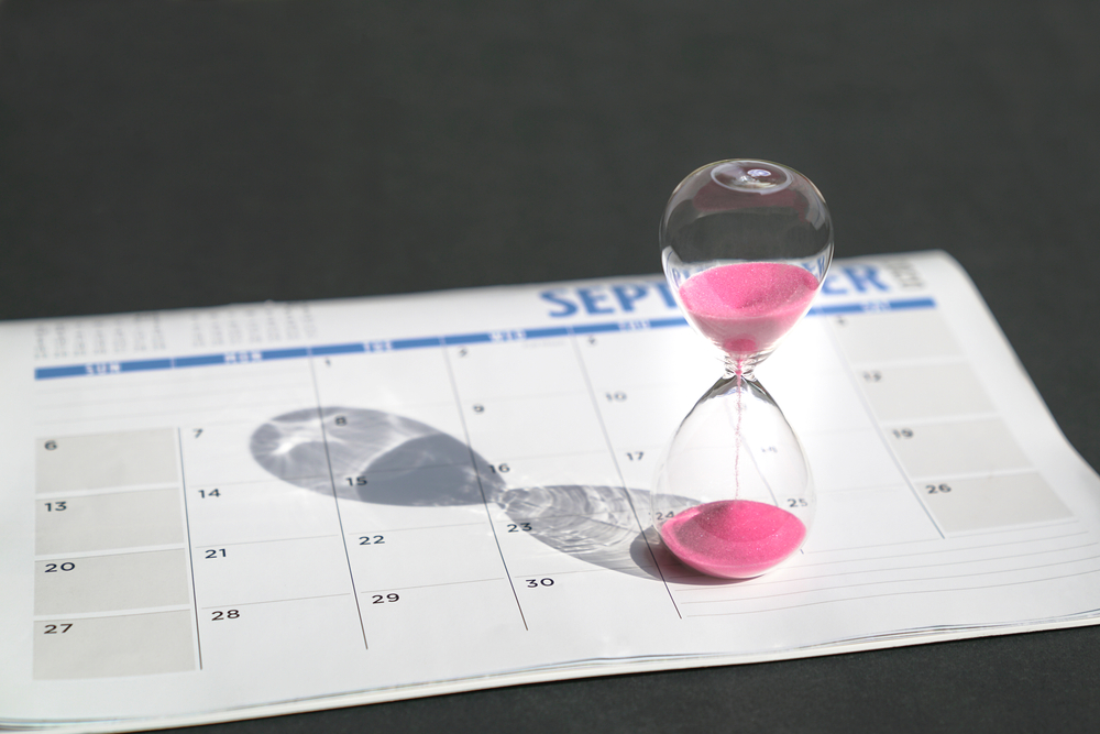 Image of an hour glass and a calendar.