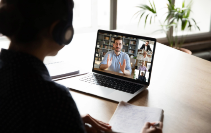 Image of a laptop being used for a video conference.